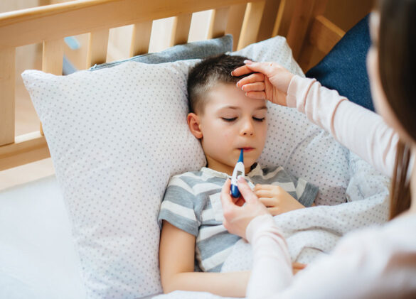 A mother takes care of her child who has a fever and fever. Disease and healthcare